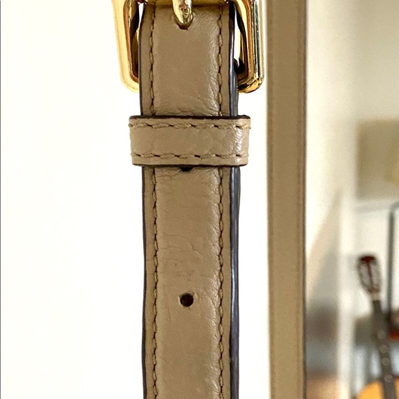Michael Khor’s beige leather crossbody purse. - Picture 3 of 4